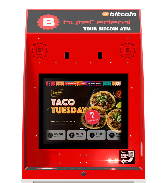 A Byte Federal Bitcoin ATM, square-on, running a taco shop ad on its screen